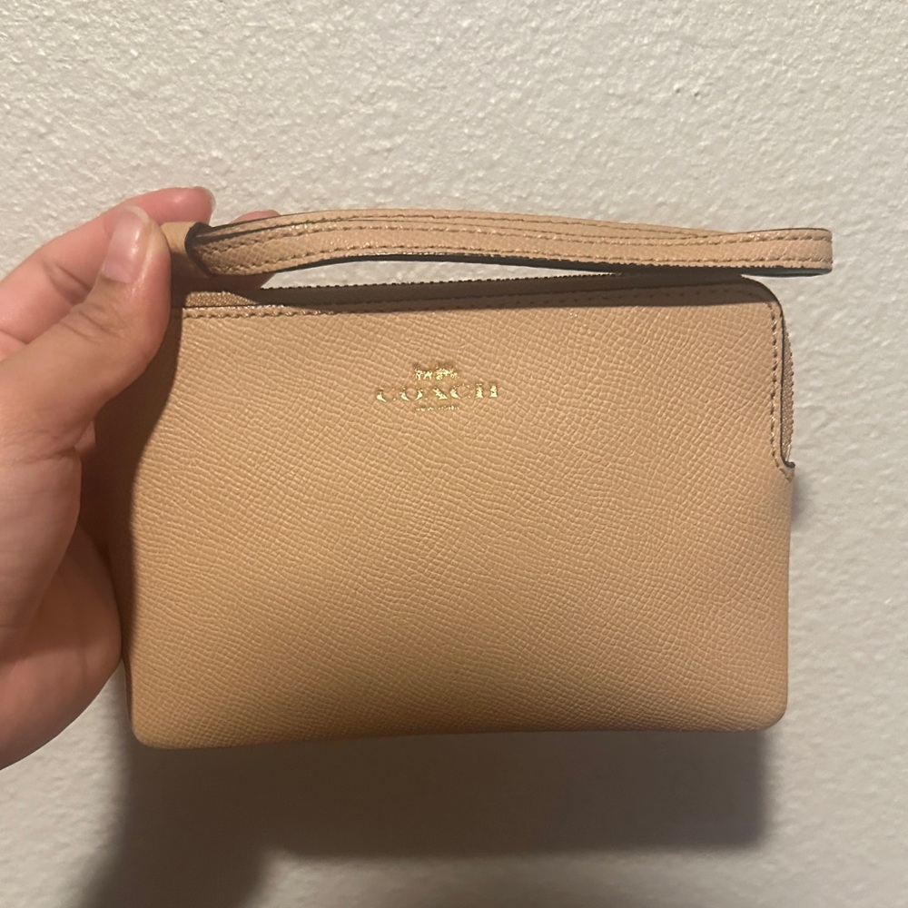 Coach Beige Pebbled Leather Wristlet with Gold Logo